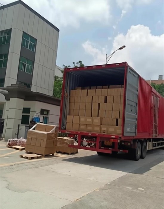Loading custom packaging boxes into shipping container for global delivery
